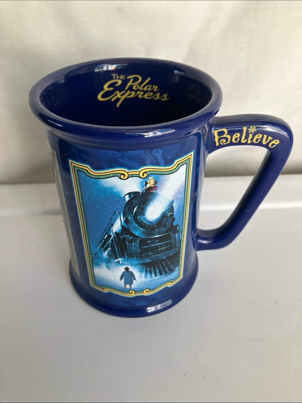 Warner Bros. The Polar Express "Believe" ceramic dark blue coffee mug—Rare